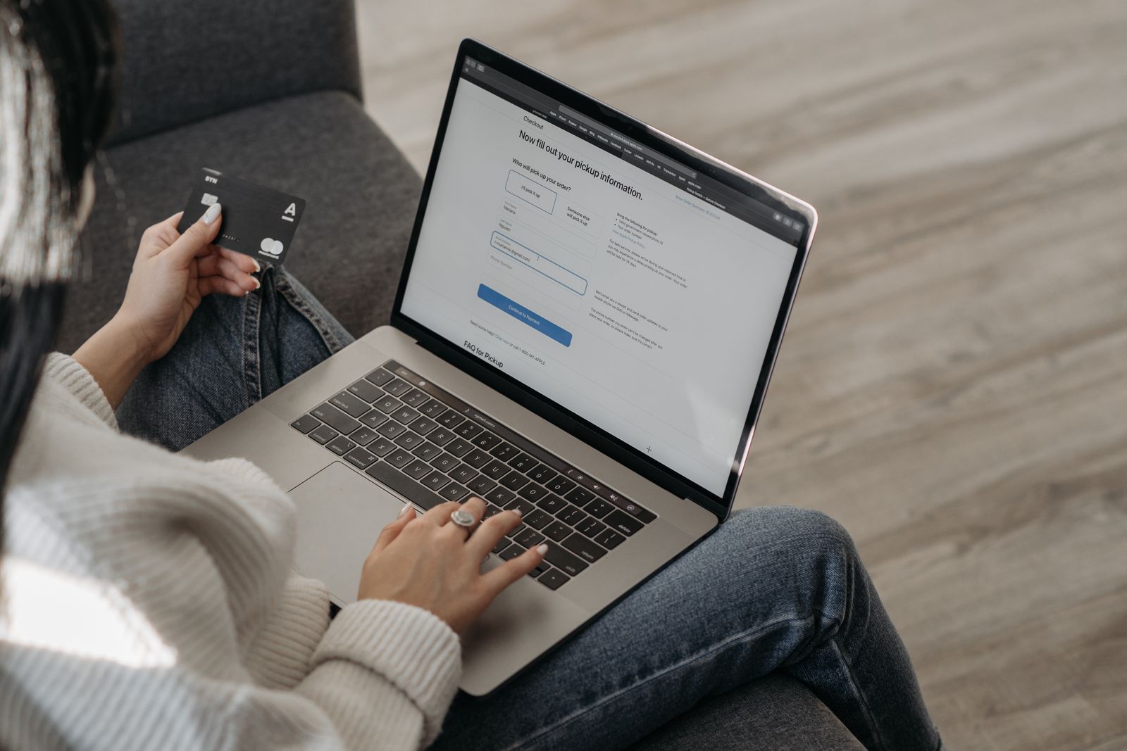 Someone completing an online order on a laptop