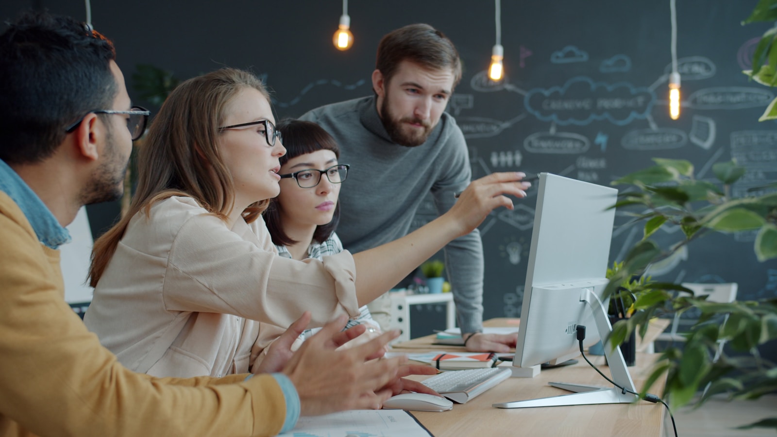 A team reviewing website analytics on a monitor